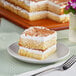 A piece of Rich's vanilla pre-soaked sponge cake on a plate.