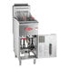 An Avantco natural gas floor fryer with a stainless steel tank and the door open.