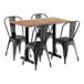 A Lancaster Table & Seating rectangular table in Yukon Oak with black metal chairs.