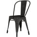 A black metal chair with a backrest.