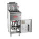 An Avantco stainless steel floor gas fryer with an open door and a basket inside.