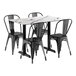 A Lancaster Table with a white marble top and 4 black chairs.