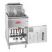 An Avantco stainless steel floor gas fryer with the door open and two baskets inside.