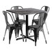 A black Lancaster Table & Seating Excalibur table with four black metal chairs.