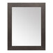 A rectangular mirror with a scratched black wood frame.