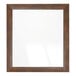 A BrandtWorks rectangular mirror with a wooden frame in mocha walnut brown.