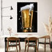 A canvas painting of a glass of beer with foam on a table.