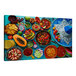 A colorful Mexican cuisine spread on a table with a blue background.