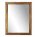 A BrandtWorks mirror with a wooden frame.