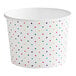 A white paper cup with colorful dots.