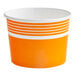 An orange and white paper cup with white stripes.