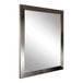 A BrandtWorks mirror with a silver frame.