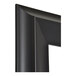 A close-up of the matte black corner of a BrandtWorks mirror.