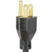 A black electrical plug with gold tips plugged into a Grindmaster stainless steel coffee warmer.