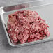 A tray of Chunk Foods Plant-Based Vegan Shredded Beef on a white table.
