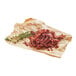 A pile of Chunk Foods plant-based shredded beef on brown paper.