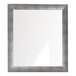 A square mirror with a vintage silver frame.