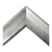 A BrandtWorks swirled silver metal mirror frame with a curved edge.