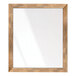 A rectangular mirror with a wooden frame on a wood surface.