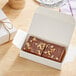 A white box of Nats Rawline chocolate hazelnut cake squares.