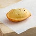 A St. Michel chocolate hazelnut-filled madeleine on a piece of paper.