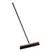 A Lavex push broom with a wooden frame and long metal handle.