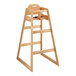 A Lancaster Table & Seating wooden high chair with a seat and tray on it.