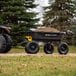 A black and yellow Gorilla yard dump cart filled with dirt.