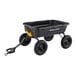 A black Gorilla Poly Yard dump cart with wheels.