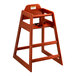A Lancaster Table & Seating wooden high chair with a seat and back.