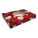 A 1/2 lb. heart candy box with an oval window and hearts on it.