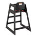 A Lancaster Table & Seating black wooden high chair with a seat belt.