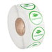 A roll of white and green Point Plus Vegetarian labels with the word "Vegetarian" in green.