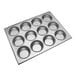 A silver Thunder Group muffin pan with 12 cupcake holes.