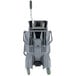 An Unger gray mop bucket with a side-press wringer and wheels.