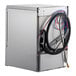 A commercial undercounter dishwasher with visible hoses and wiring on the back panel.