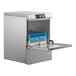 A stainless steel high temperature undercounter dishwasher with an open front door and a blue dish rack inside.