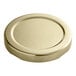 A close up of a gold metal 58 Lug lid with plastisol liner.