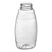 A clear plastic Classic Queenline honey bottle with a black lid.