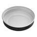 A white plastic bowl with a black metal lid on top.