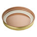 A close up of a 58/400 gold metal lid with plastisol liner.