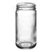 A close-up of a 6.5 oz. clear Paragon glass jar with a lid.