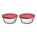 Two glass containers with red lids.