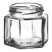 A 4 oz. clear glass hex jar with a lid.