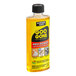 A yellow Goo Gone Pro-Power Adhesive Remover bottle with black and red text on a counter.