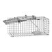 A Havahart small metal cage trap with a handle.