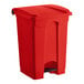 A red Lavex step-on trash can with a black lid.