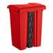 A red rectangular step-on trash can with black handles.