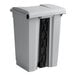 A gray rectangular Lavex step-on trash can with a black lid.