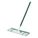 A Libman microfiber floor mop with a green handle.